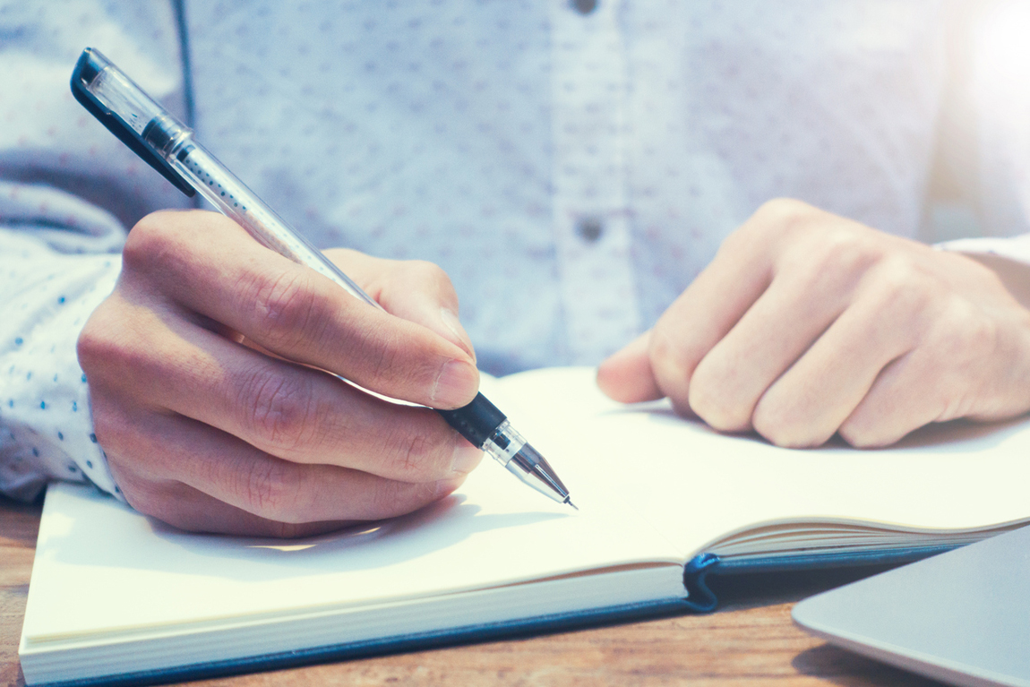 writing in notebook