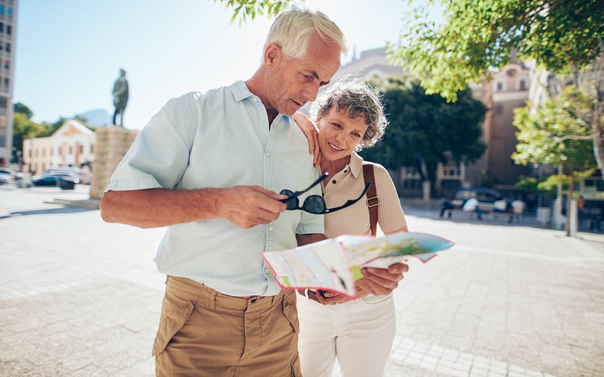 Senior couple trying to read street map