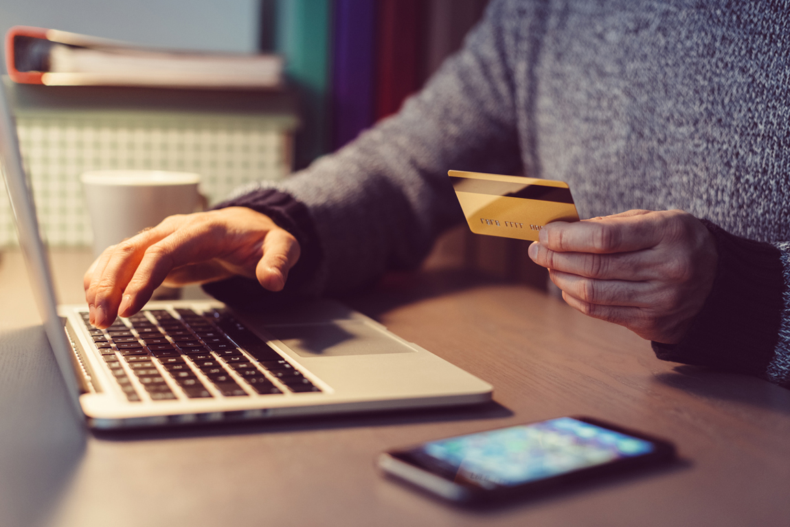 Man shopping online with credit card