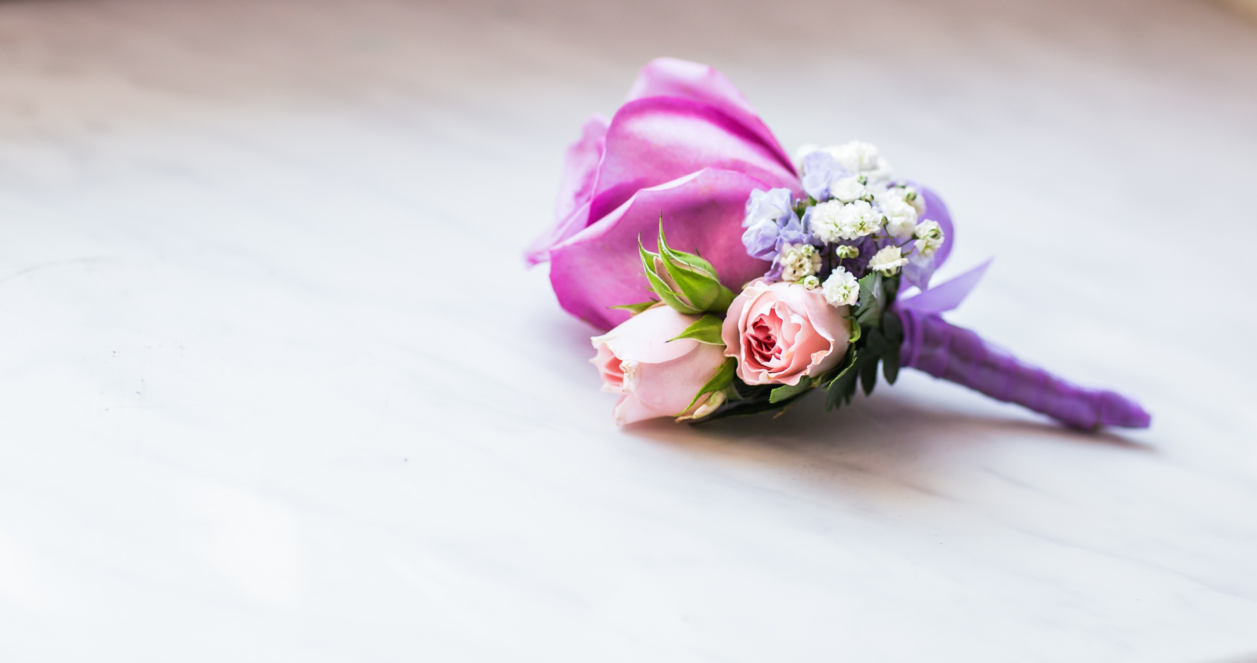 close-up of  Gentle groom’s boutonniere