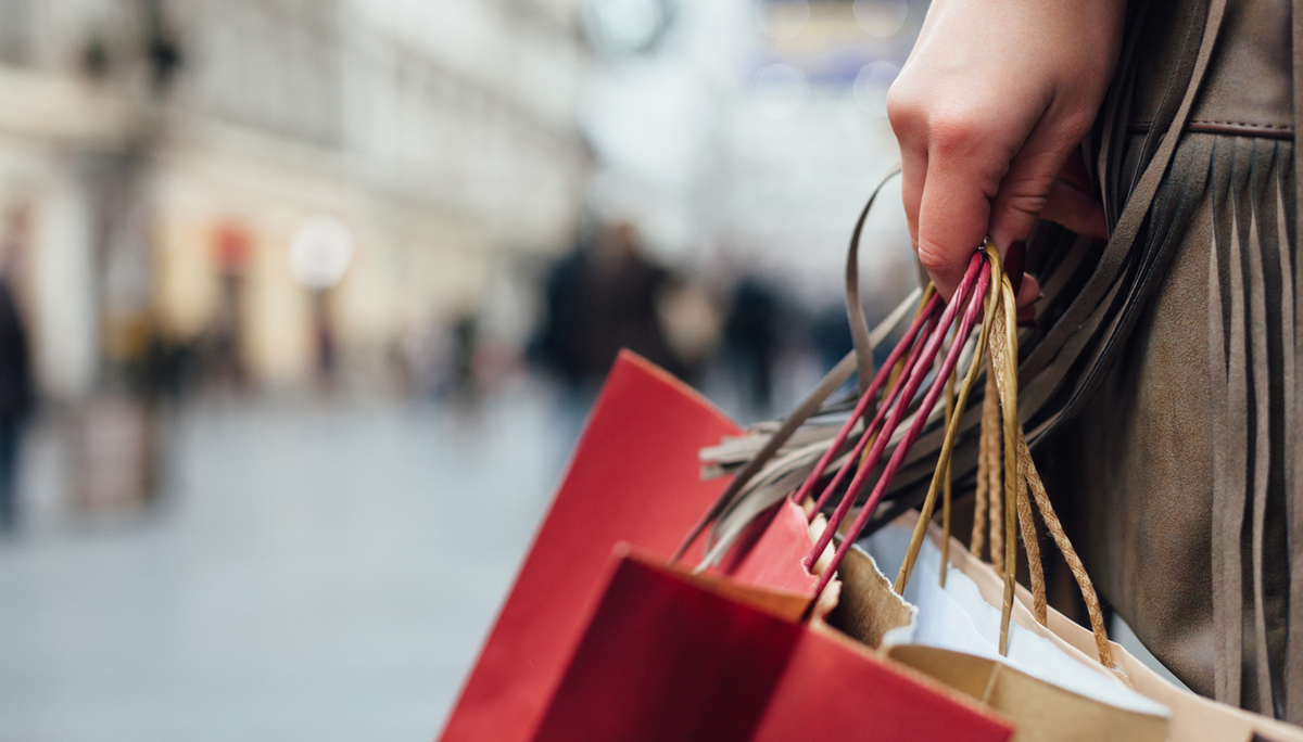 Closeup of woman holding shopping bags