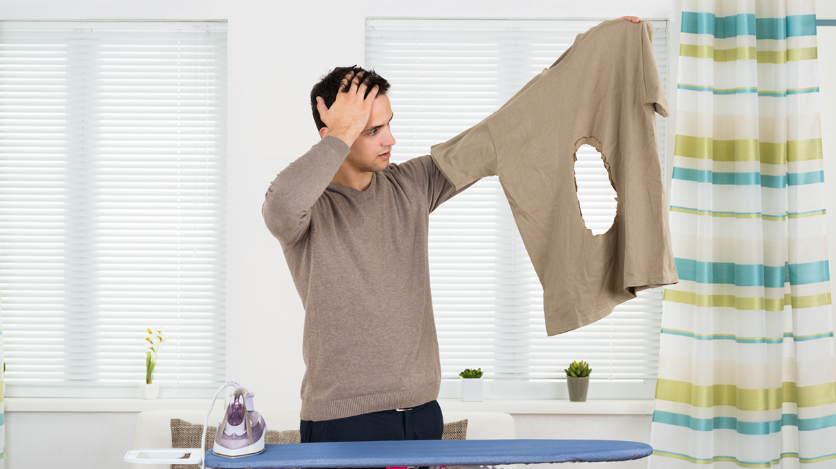 Amazed Man Looking At Iron Burnt Tshirt