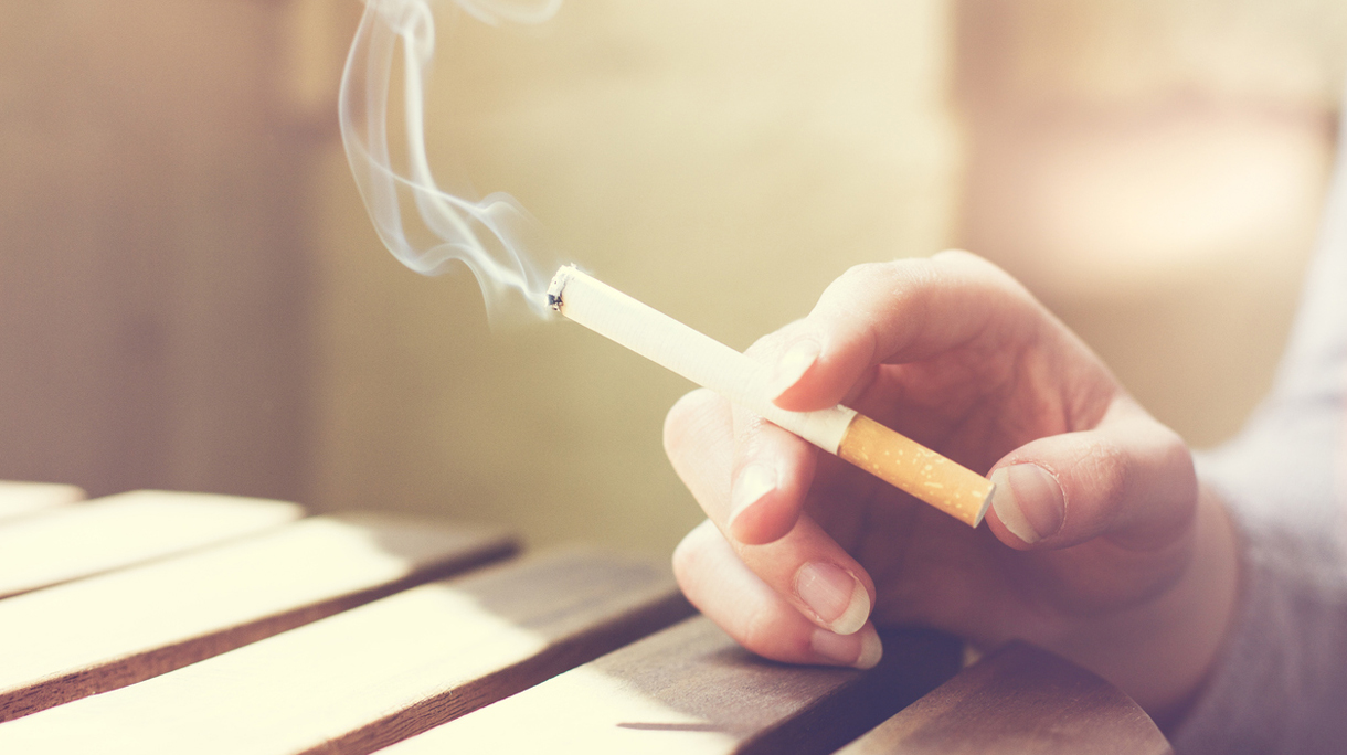 Woman smoker smoking a filter tip