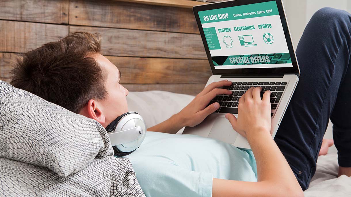 Man shopping by internet with laptop.