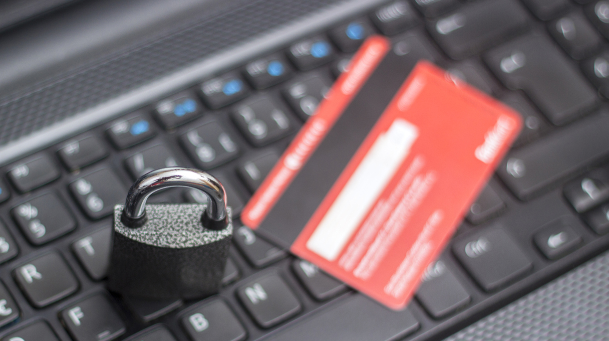 Credit card with security lock on computer keyboard