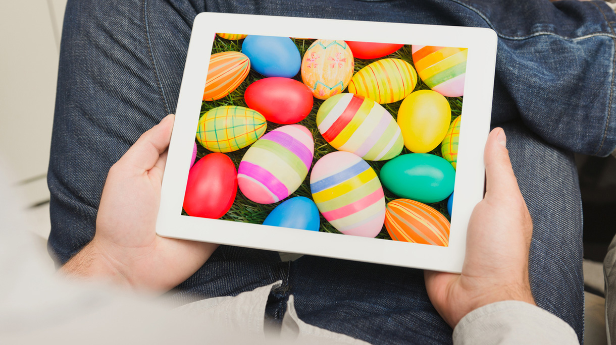 Guy watching an easter images on his digital tablet