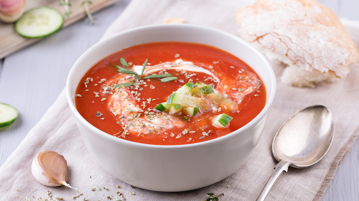 fresh tomato soup in a grey bowl