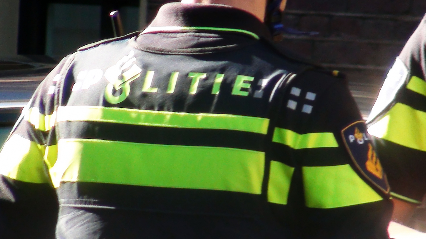 Dutch Police Officer In Police Uniform Standing On The Street.Netherlands.Europe