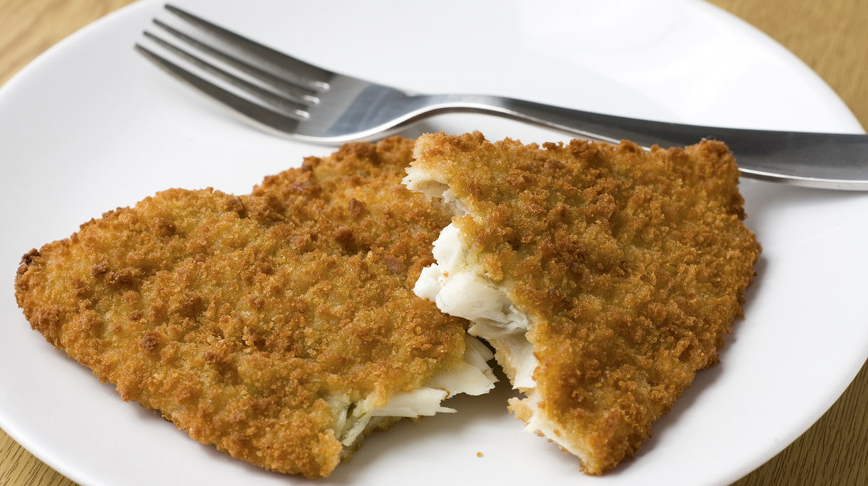Breaded fish fillet served on a plate
