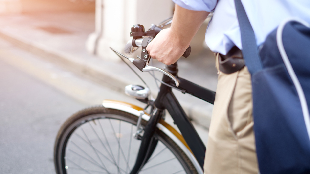 Close-up of man riding his bike in the street