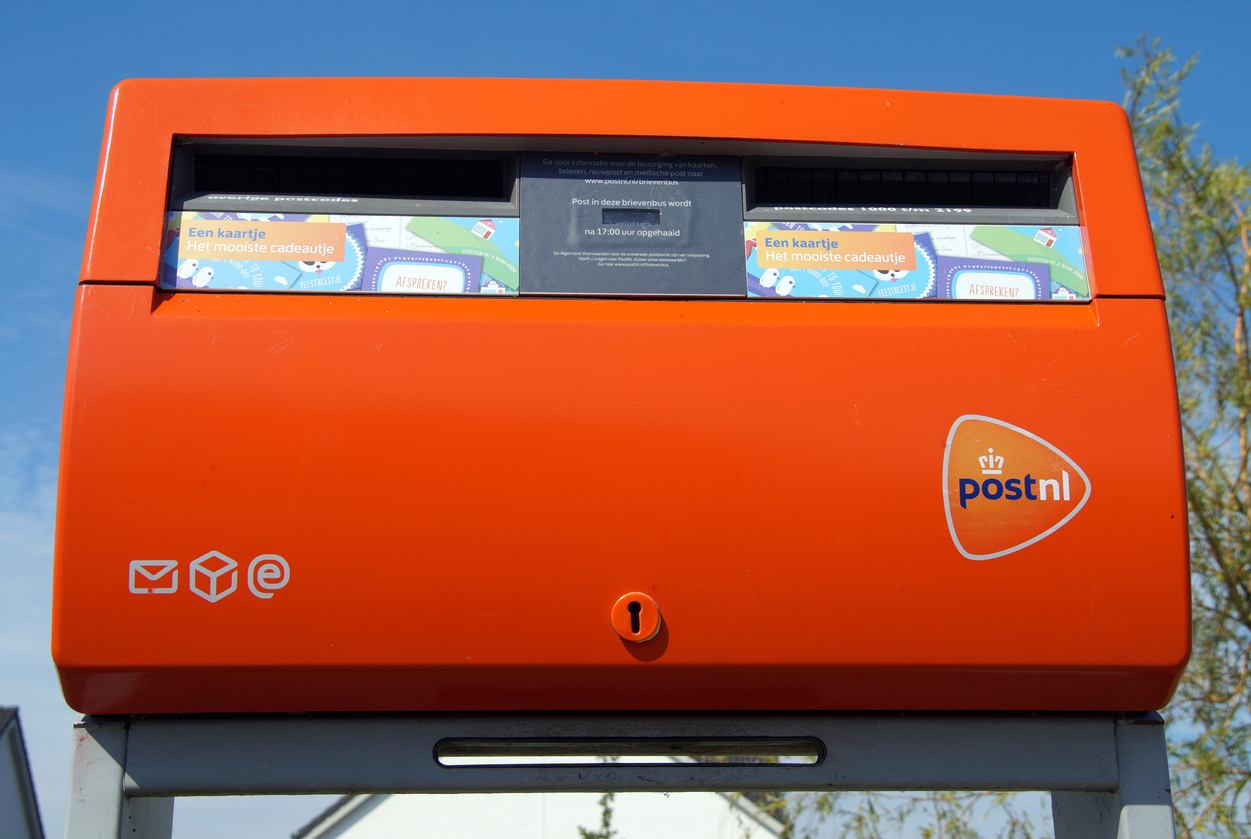 Bright orange Dutch PostNL mailbox