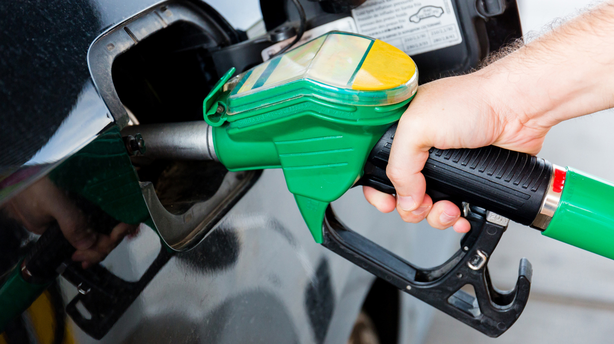 Handle fuel nozzle to refuel. Vehicle fueling facility.