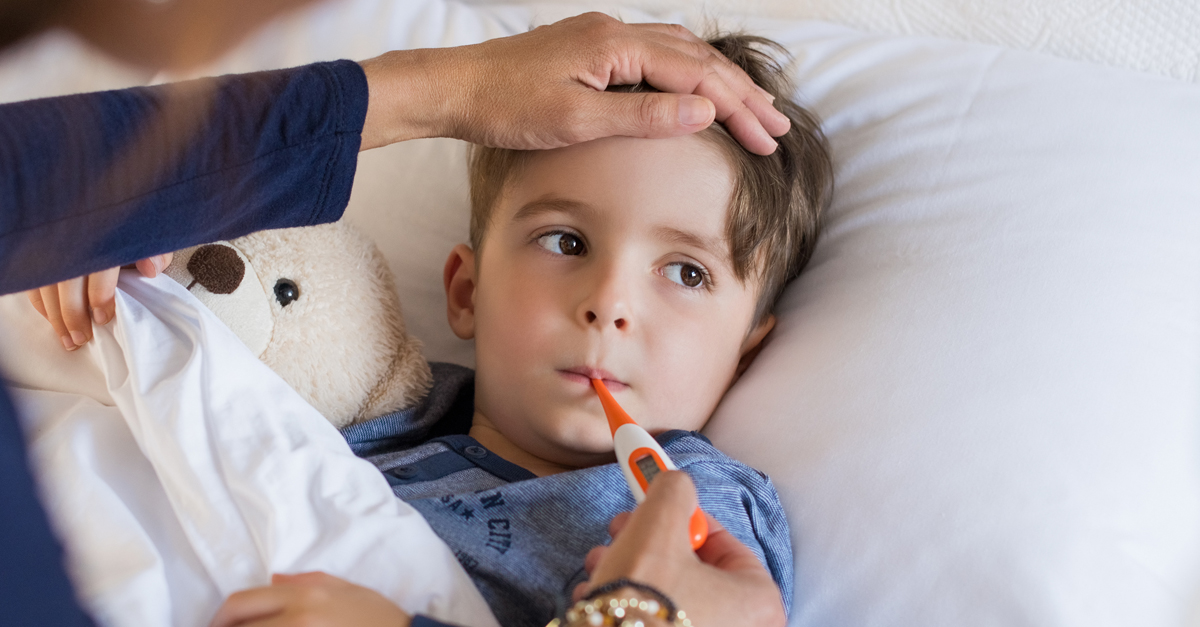 Boy measuring fever