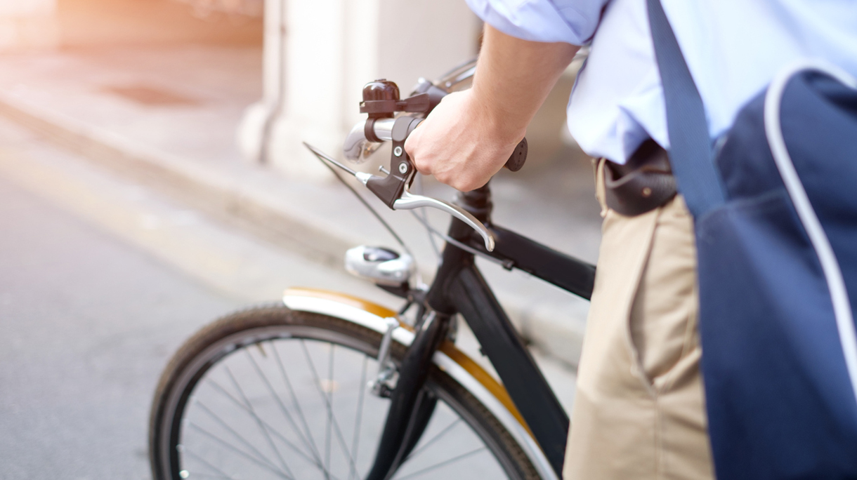 Close-up of man riding his bike in the street