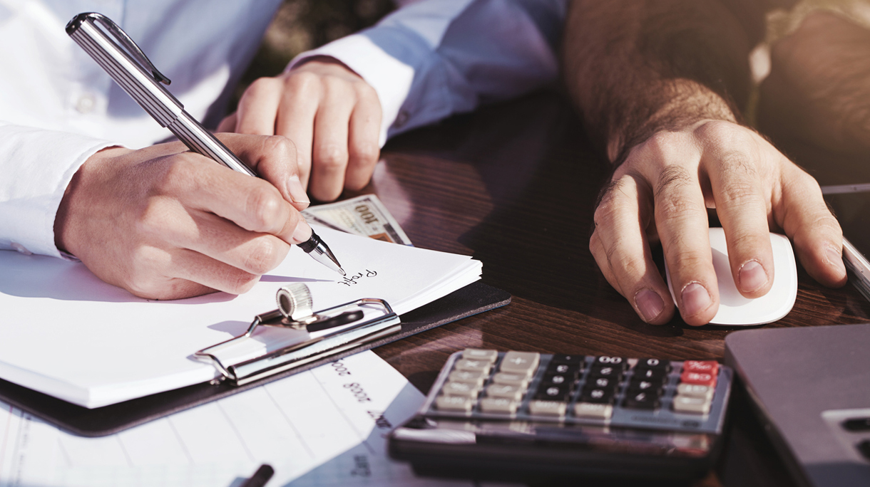 Office, business tools with dollars and calculator on table
