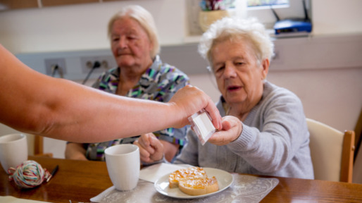 Seniors Having Breakfast In Elderly Day Care Center