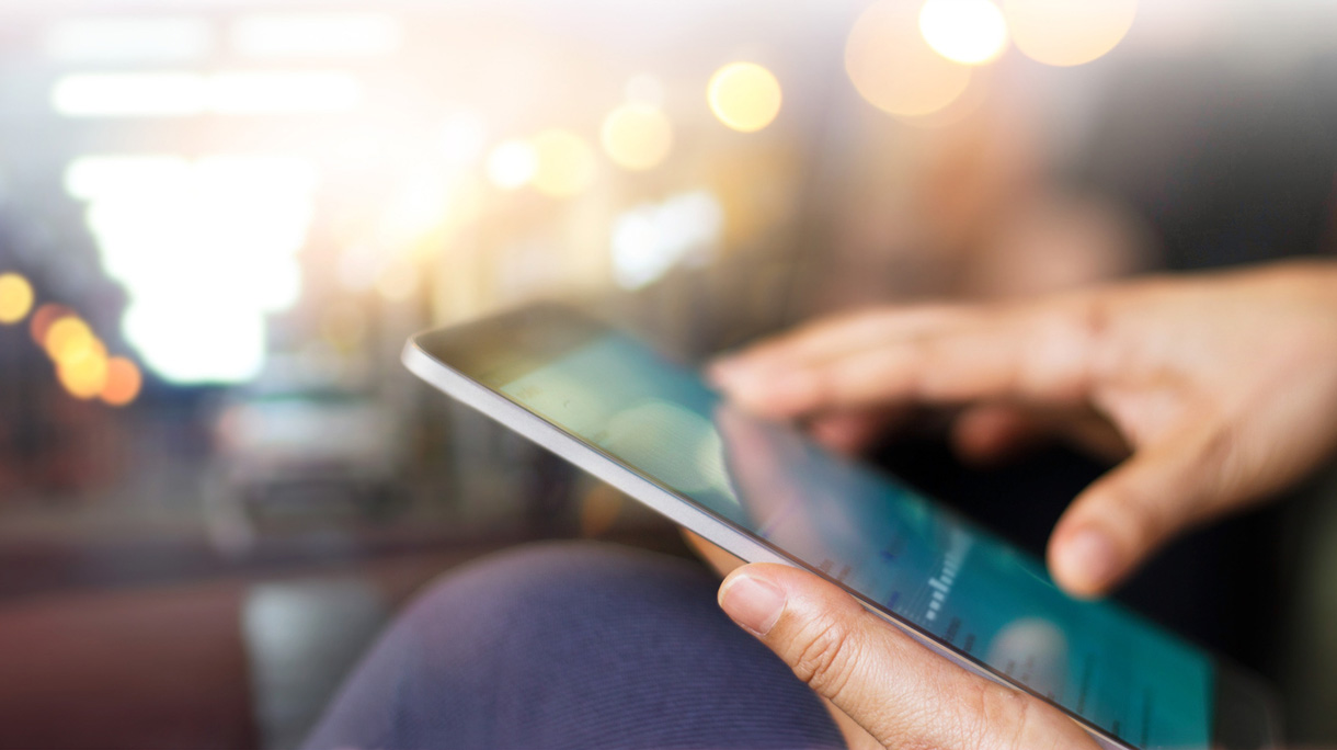 Businessman using tablet at night time
