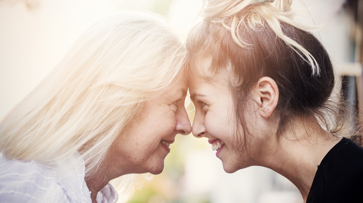 Smiling mother with young daughter