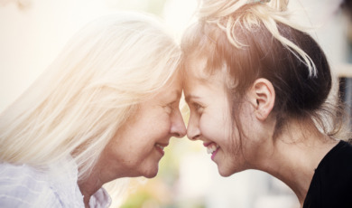 Smiling mother with young daughter