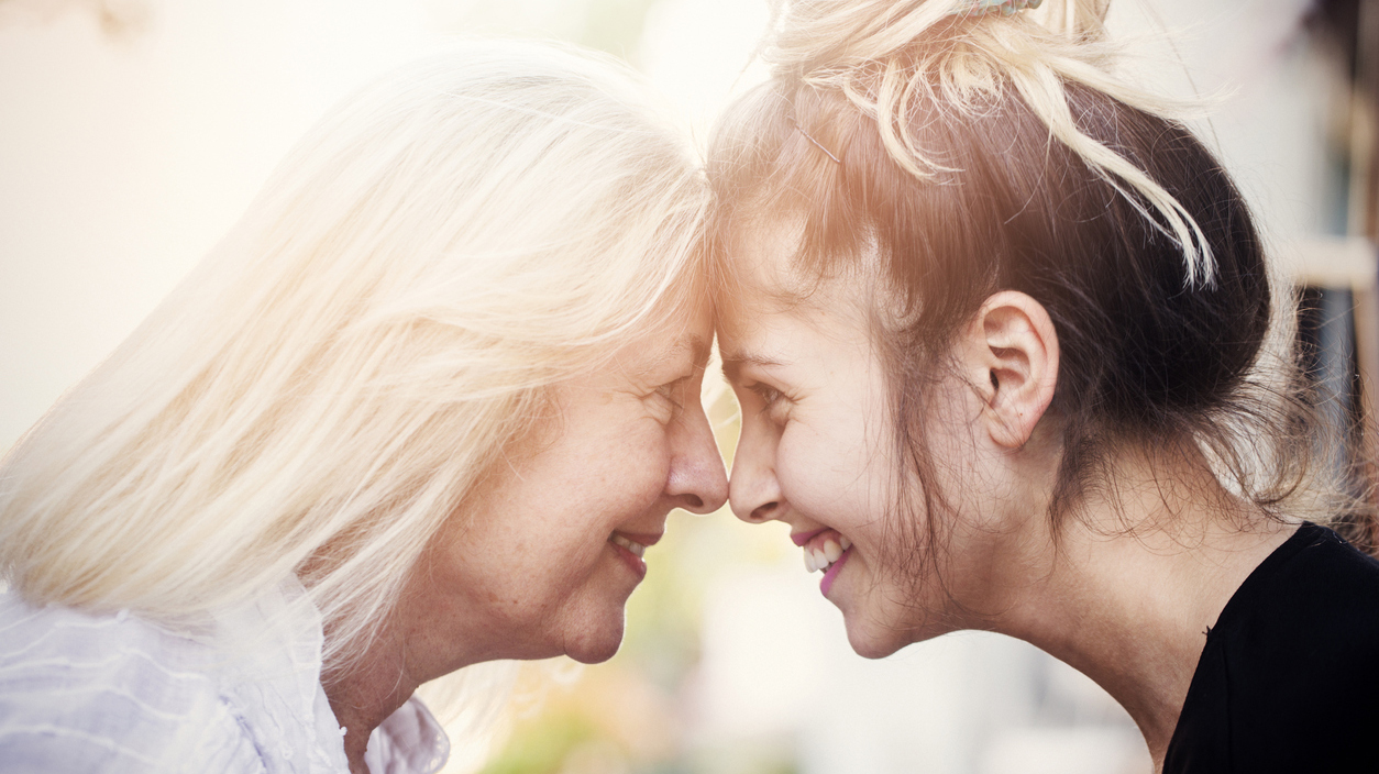 Smiling mother with young daughter