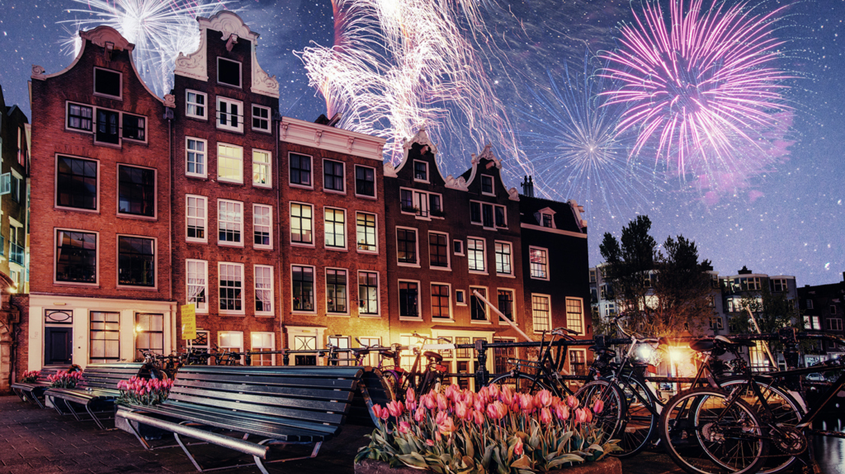 Beautiful calm night view of Amsterdam city. Colorful fireworks