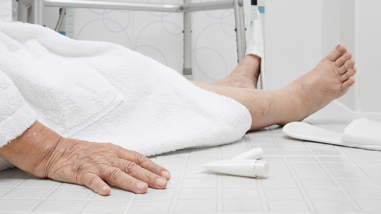Elderly woman falling in bathroom because slippery surfaces