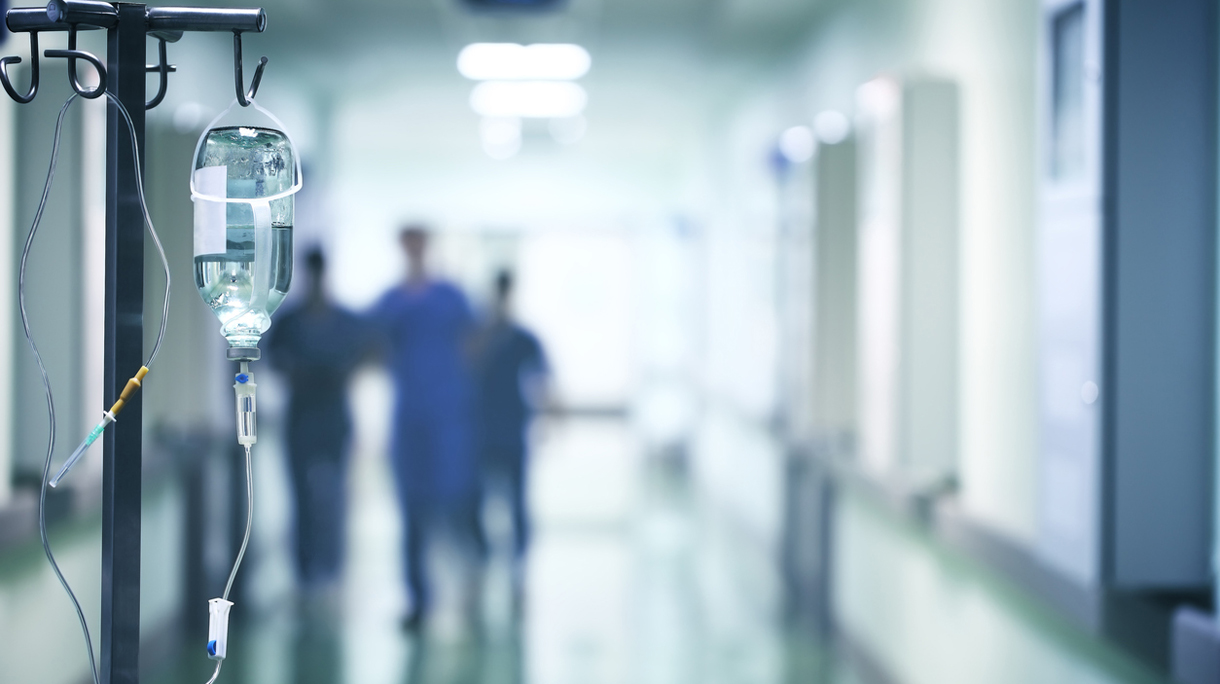 Group of doctors in a hurry down the hospital hallway