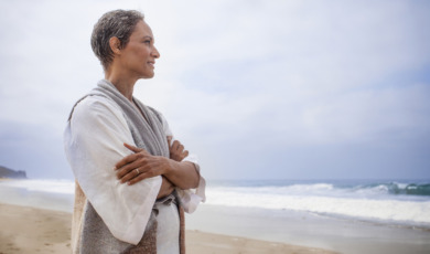 Senior Black Woman Relaxing on Beach