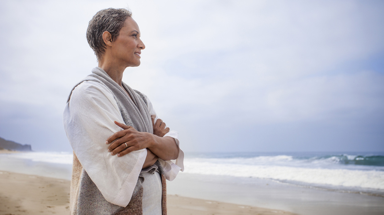 Senior Black Woman Relaxing on Beach
