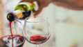 Pouring red wine in glasses