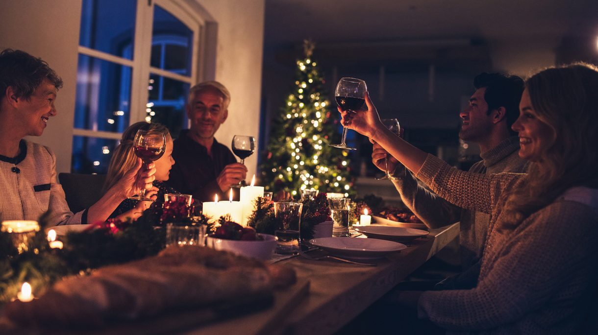 Extended family toasting wine at christmas dinner