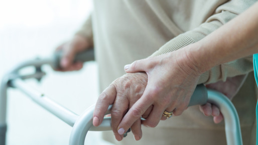 Close-up of woman using walker