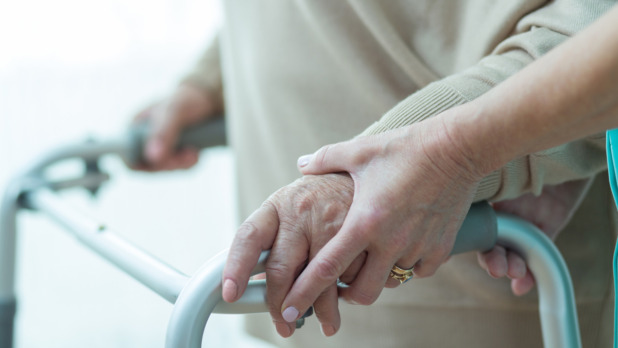 Close-up of woman using walker