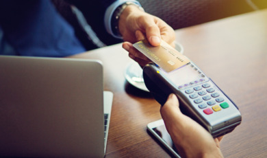 businessman-is-paying-in-the-cafe-picture-id645279618