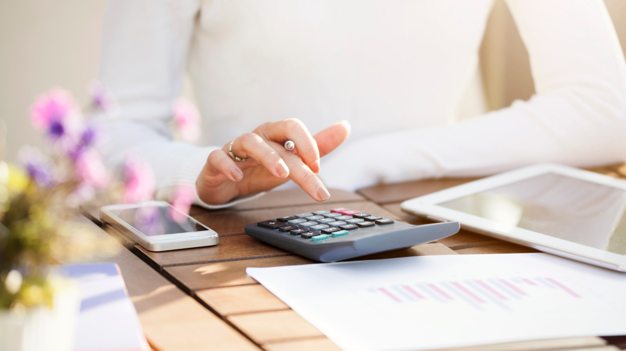 businesswoman-using-calculator-picture-id622046306_0