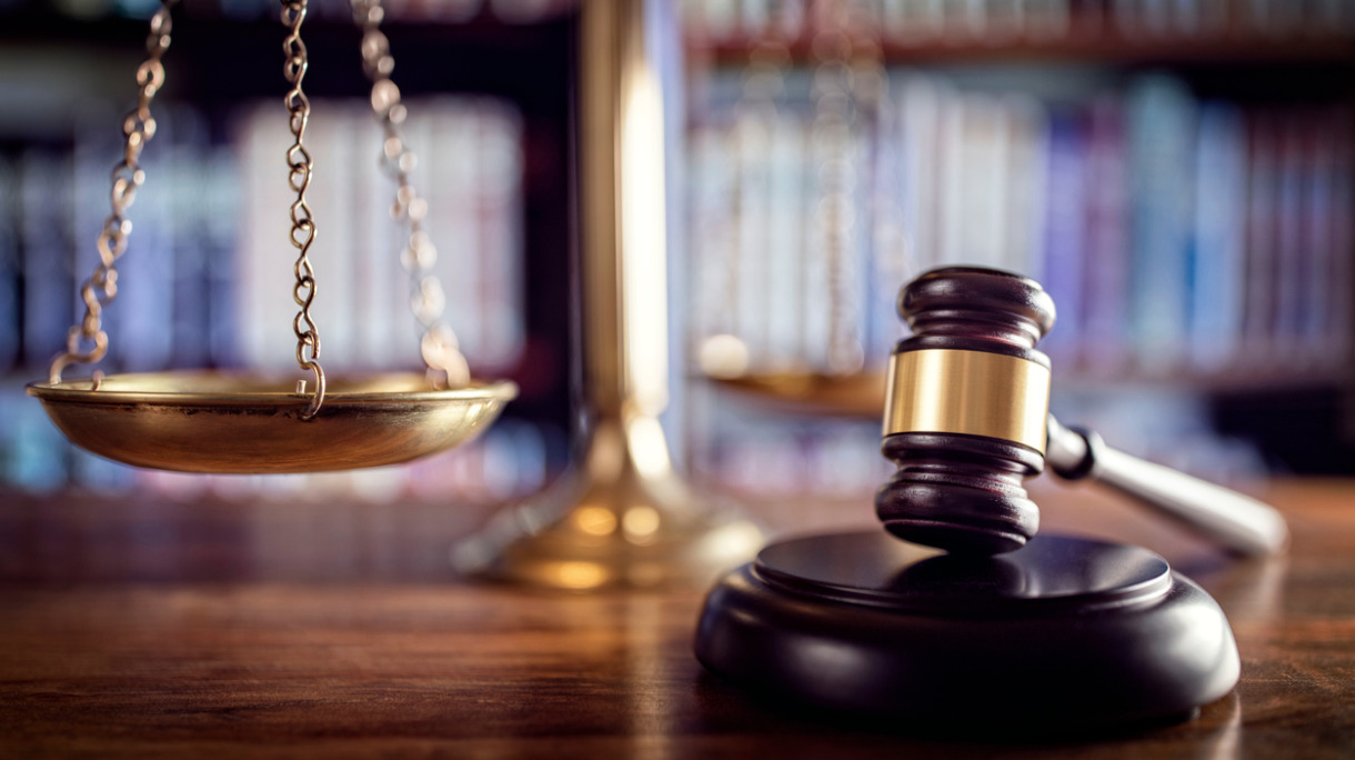 gavel-scales-of-justice-and-law-books-picture-id509557490