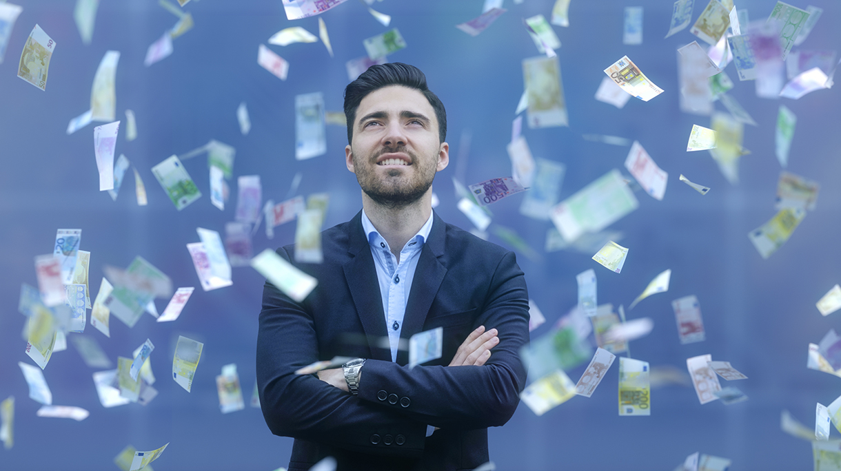 Businessman with raining banknotes