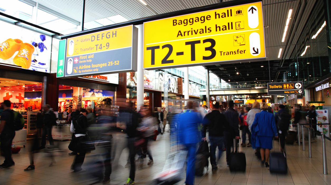 Passengers are walking in Amsterdam Airport Schiphol, Netherland