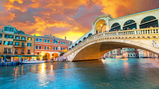 Bright charming panoramic landscape Rialto Bridge in Venice, Italy, Europe, at sunset
