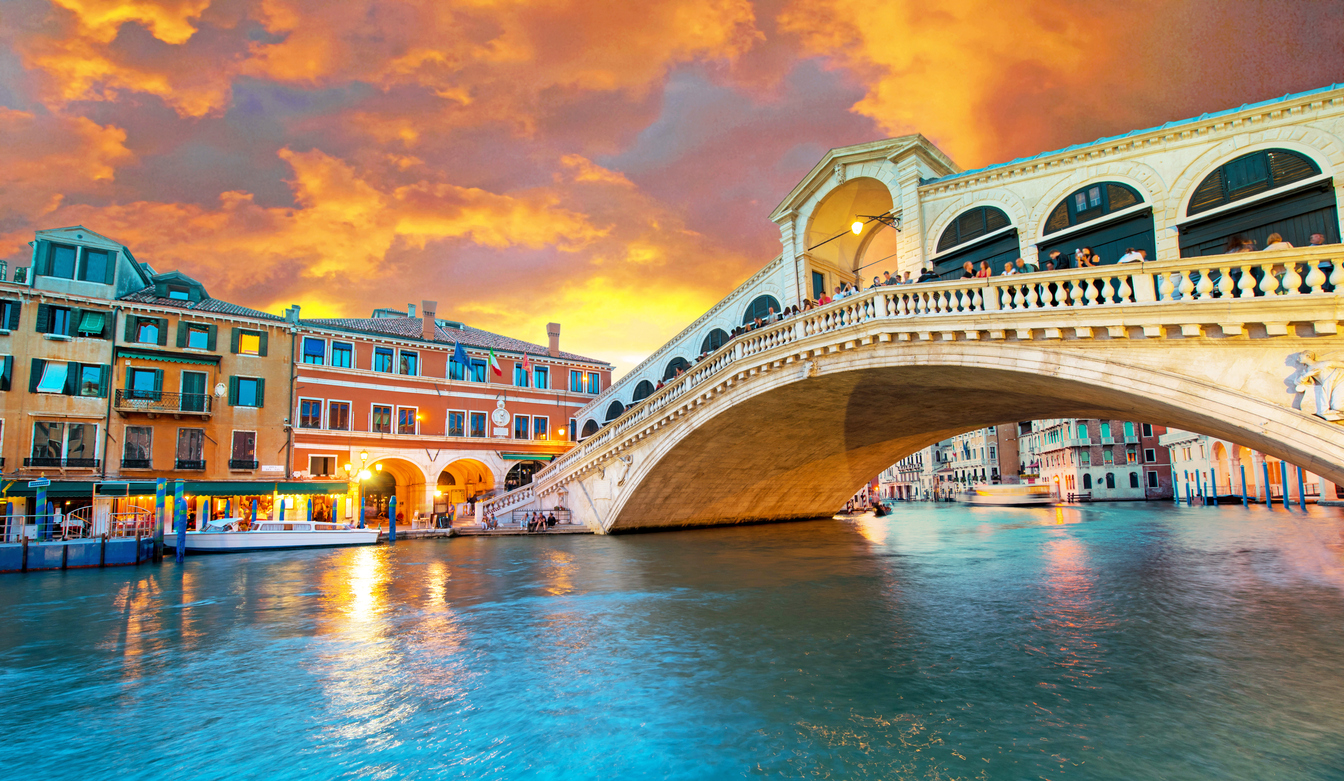 Bright charming panoramic landscape Rialto Bridge in Venice, Italy, Europe, at sunset