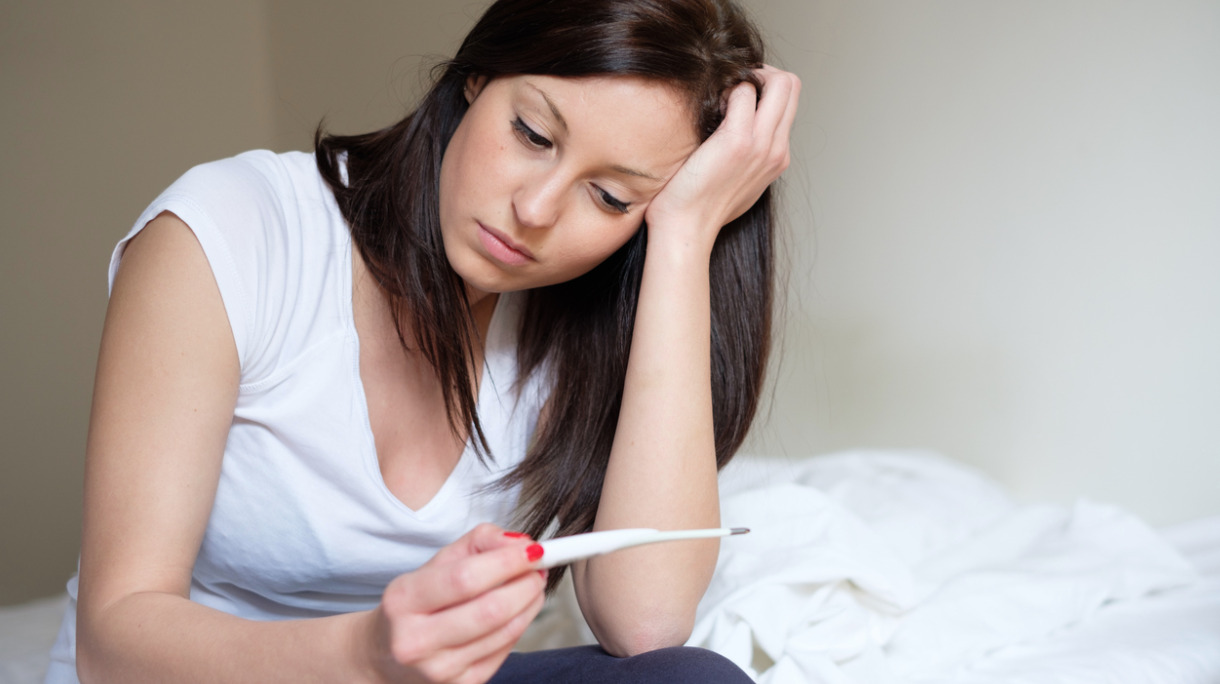 woman-feeling-depressed-and-sad-after-looking-at-pregnancy-test-picture-id682969514