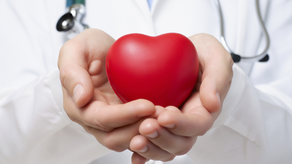 Doctor protecting a heart