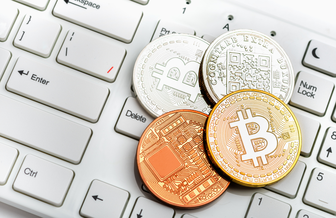Bitcoin coin on white keyboard
