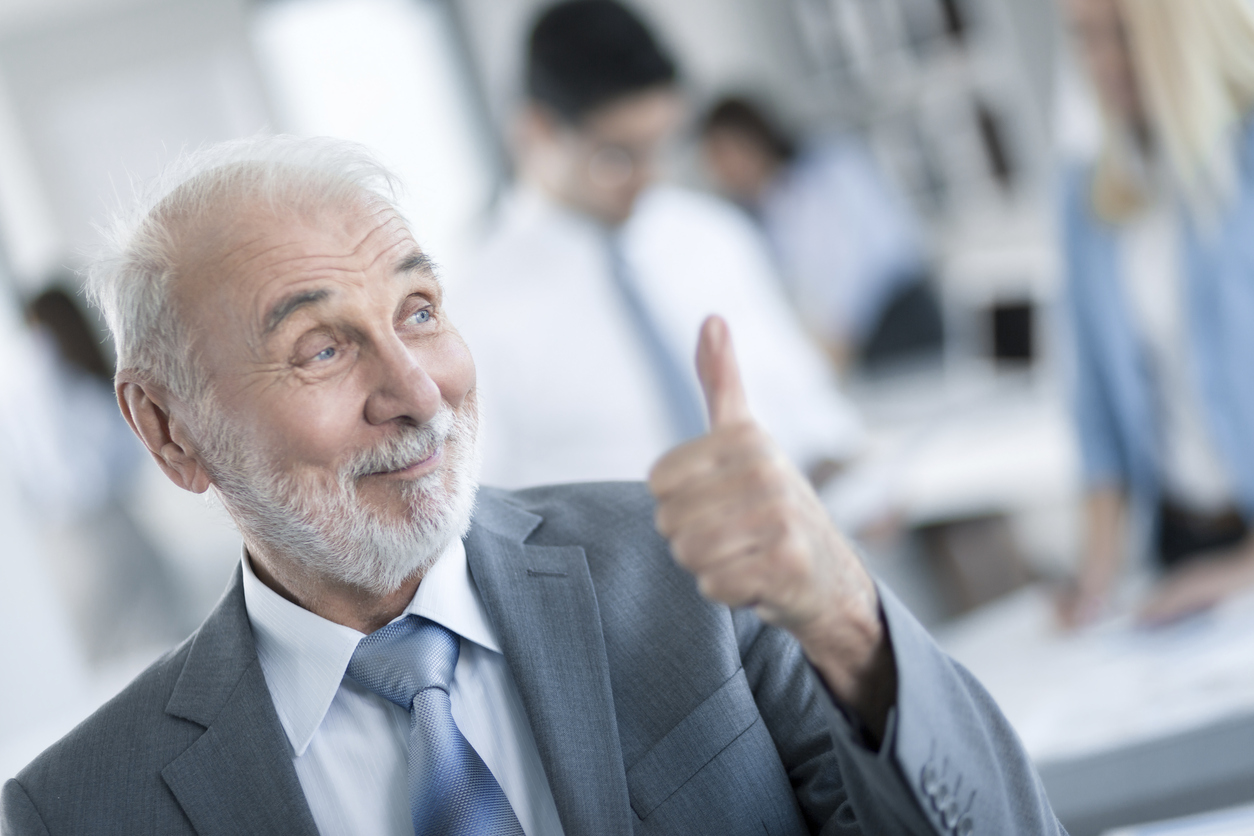 Senior Business Man showing thumbs up