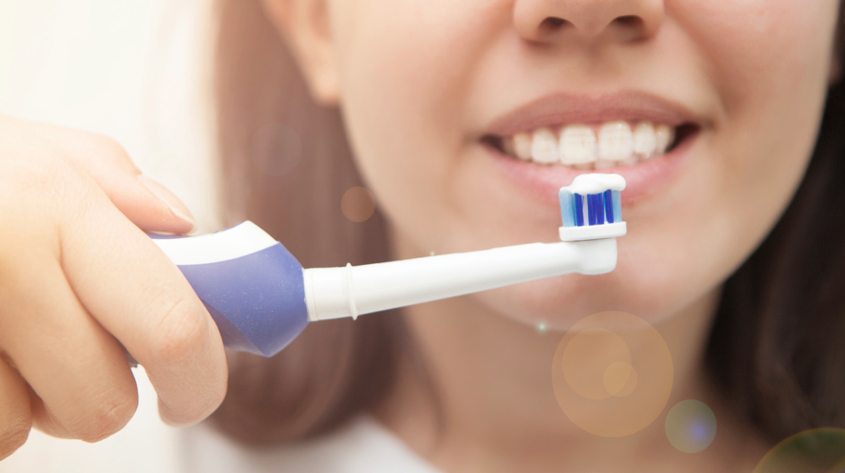 closeup-on-young-woman-brushing-teeth-picture-id649864104