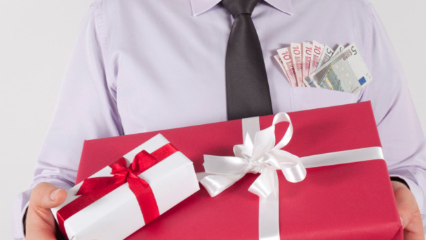 gifts-in-arms-beside-money-picture-id158678976