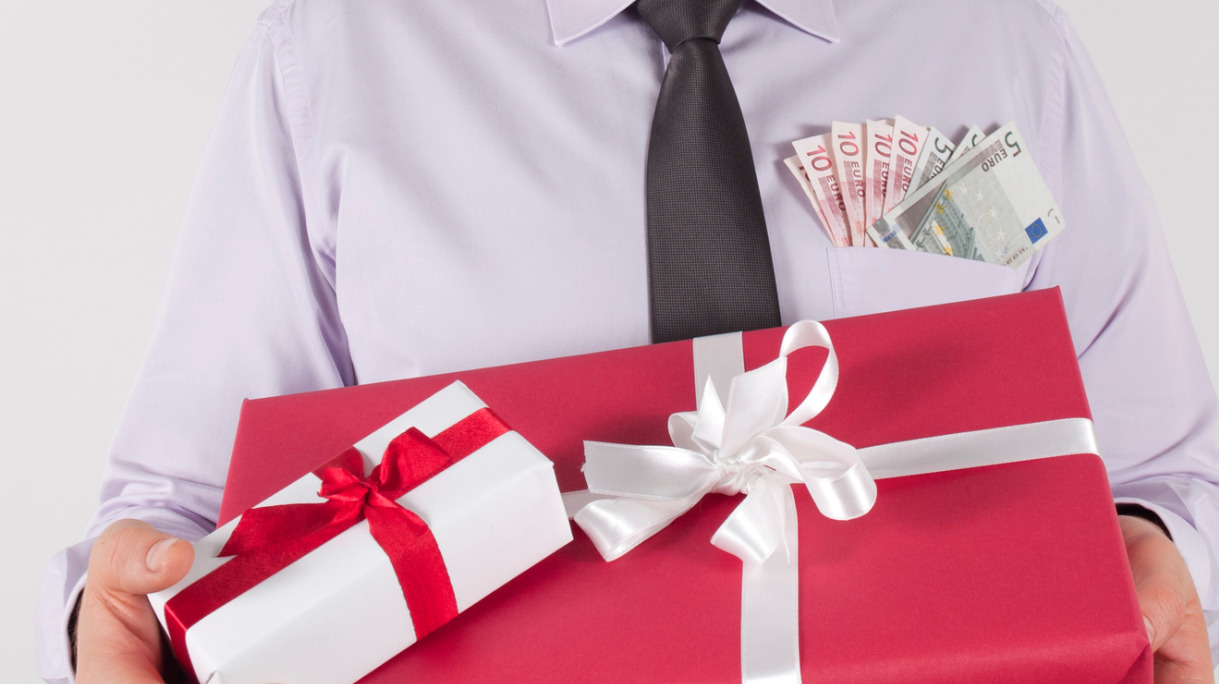 gifts-in-arms-beside-money-picture-id158678976