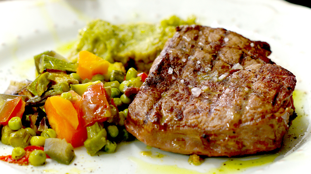 steak cooked rare with vegetables