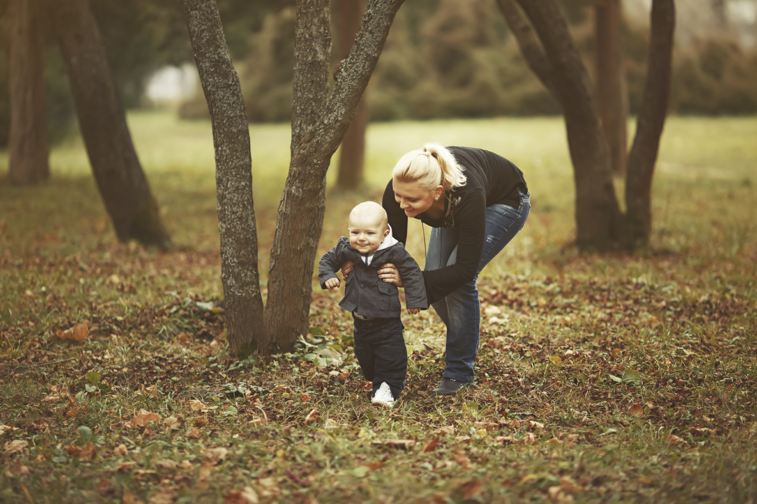 Yong mother with her lovely son in garden