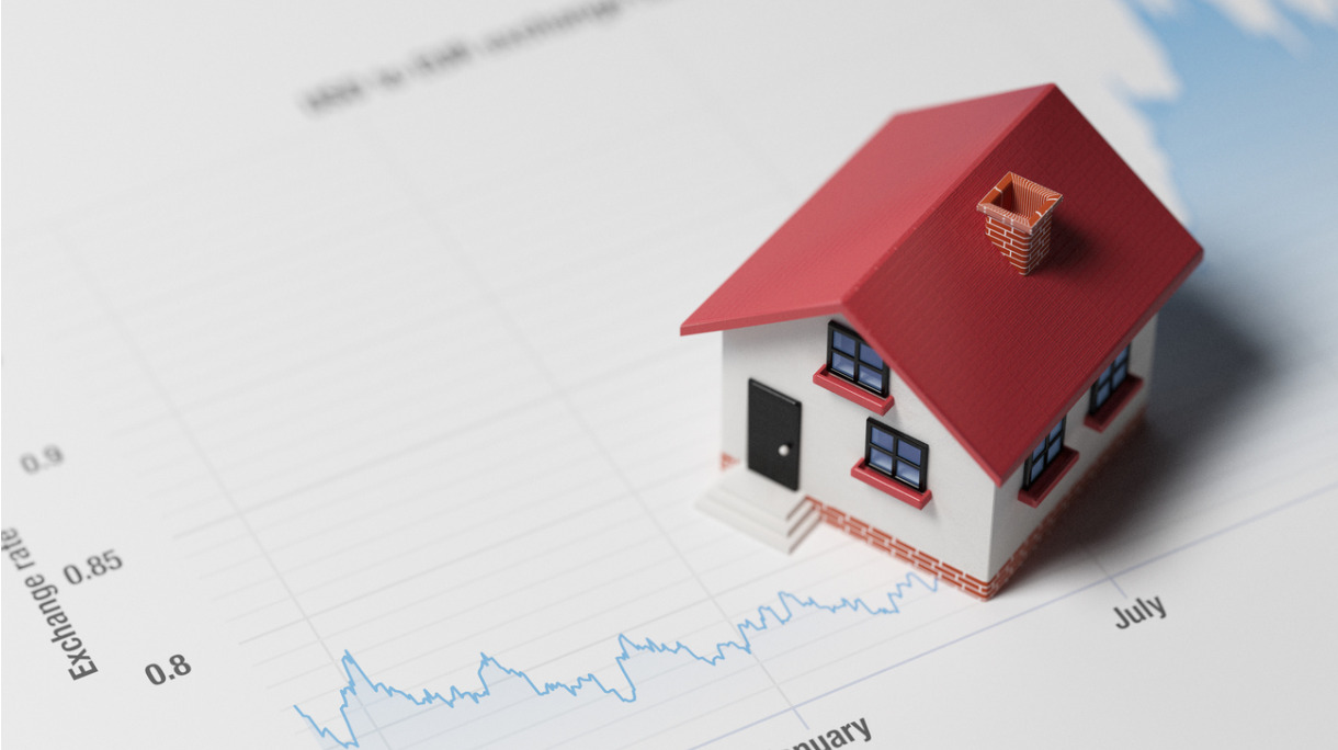 miniature-house-on-a-blue-financial-graph-picture-id640163076